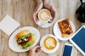 Two cups of coffee, friendly atmosphere. Chicken sandwich, Cup of coffee and smartphone on the table Royalty Free Stock Photo