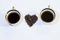 Two cups of coffee and heart grains