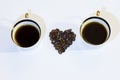 Two cups of coffee and heart grains