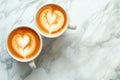 Two cups of coffee with heart latte art, date concept. Valentine\'s day or coffee lovers. Couple of cappuccino cups on wooden Royalty Free Stock Photo