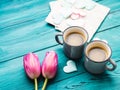 Two cups of coffee, hearts and tulip flowers. Royalty Free Stock Photo