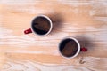 Two cups of coffee on a light brown table. Directly above Royalty Free Stock Photo