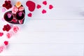 Two cups of coffee, macaroons with flowers in a box in the form of a heart on a white background. Valentine`s day Royalty Free Stock Photo