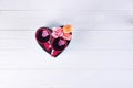 Two cups of coffee, macaroons with flowers in a box in the form of a heart on a white background. Valentine`s day Royalty Free Stock Photo