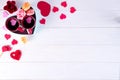 Two cups of coffee, macaroons with flowers in a box in the form of a heart on a white background. Valentine`s day Royalty Free Stock Photo