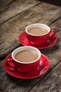 Two Cups of Coffee with Milk on old Wood Background. Royalty Free Stock Photo