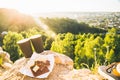 Two cups of coffee on the peak of the hill