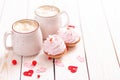 Two cups coffee and pink cream cupcakes on white wooden background. Concept Valentine`s Day, birthday, Wedding day Royalty Free Stock Photo