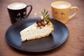 Two cups with a coffe is on a plate near a piece of cake Royalty Free Stock Photo