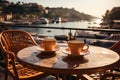 Two cups of coffee on a table of outdoor restaurant in small seaside town in Italy. Having breakfast coffee in Italian scenery on Royalty Free Stock Photo