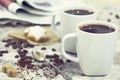 Two cups of coffee on wooden table