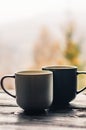 Two cups with coffee on the wooden table Royalty Free Stock Photo