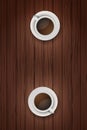 Two cups of coffee on wooden table Royalty Free Stock Photo