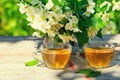 Two cups of green tea with jasmine flowers Royalty Free Stock Photo