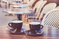 Two cups of hot chocolate or coffee cappuccino Royalty Free Stock Photo