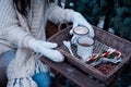 Two cups of hot cocoa in a wicker basket on a wooden table. Royalty Free Stock Photo