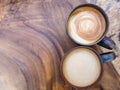 Two cups of hot coffee cappuccino on wood texture background, to Royalty Free Stock Photo