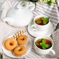 Two cups of hot tea with delicious cookies on white wooden table Royalty Free Stock Photo