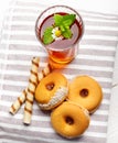 Two cups of hot tea with delicious cookies on white wooden table Royalty Free Stock Photo