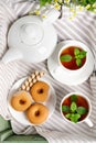 Two cups of hot tea with delicious cookies on white wooden table Royalty Free Stock Photo