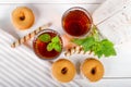 Two cups of hot tea with delicious cookies on white wooden table Royalty Free Stock Photo