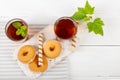 Two cups of hot tea with delicious cookies on white wooden table Royalty Free Stock Photo