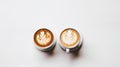 two cups of latte art coffee on a white surface top view Royalty Free Stock Photo