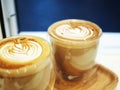 Two Cups of Latte with Latte Art in a Double Insulated Glass