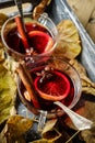 Two cups with mulled wine with orange, cardamom and cinnamon in