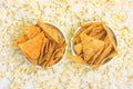 Two cups of nachos on a background of popcorn top view Royalty Free Stock Photo