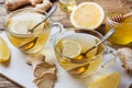 Two cups of natural herbal tea ginger lemon and honey on a wooden background Royalty Free Stock Photo