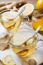 Two cups of natural herbal tea ginger lemon and honey on a wooden background Royalty Free Stock Photo