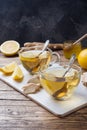 Two cups of natural herbal tea ginger lemon and honey on a wooden background. Copy space Royalty Free Stock Photo