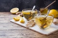 Two cups of natural herbal tea ginger lemon and honey on a wooden background. Copy space Royalty Free Stock Photo