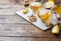 Two cups of natural herbal tea ginger lemon and honey on a wooden background. Copy space Royalty Free Stock Photo