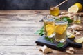 Two cups of natural herbal tea ginger lemon mint and honey on a wooden background. Copy space Royalty Free Stock Photo