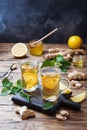 Two cups of natural herbal tea ginger lemon mint and honey on a wooden background. Copy space Royalty Free Stock Photo