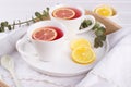 Two cups of red fruit and herbal tea with lemon slice, Royalty Free Stock Photo