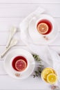 Two cups of red fruit and herbal tea with lemon slice, Royalty Free Stock Photo