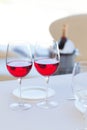 Two cups of red wine and bottle in ice bucket Royalty Free Stock Photo