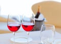 Two cups of red wine and bottle in ice bucket Royalty Free Stock Photo