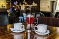 Two cups of tea and delicious berry tea from fresh berries, for a pleasant evening rest of two friends, the interior Royalty Free Stock Photo