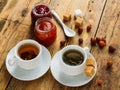 Two cups of tea, jam and dried fruit on an old wooden table Royalty Free Stock Photo