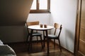 Two cups on wooden table. Dining room with table and two chairs. Modern minimal Scandinavian nordic interior. Morning coffee Royalty Free Stock Photo