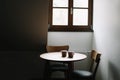 Two cups on wooden table. Dining room with table and two chairs. Modern minimal Scandinavian nordic interior. Morning coffee Royalty Free Stock Photo