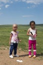 Two curieus kids in Mongolian Royalty Free Stock Photo