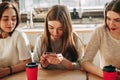 Two curious women spying for their friend