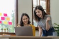 Two cute asian businesswoman sitting at table discussing financial accounting Royalty Free Stock Photo