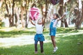 Two cute asian child girl play and throwing their backpack