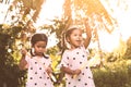 Two cute asian child girls having fun to play with bubbles Royalty Free Stock Photo